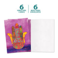 Load image into Gallery viewer, The cover and inside of Tree-Free’s Hamsa Blessings card, along with the following text: “6 greeting cards, 6 matching envelopes”