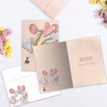 Load image into Gallery viewer, The inside of Tree-Free’s 16 with Love card, with the cover and envelope in the background.