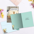 Load image into Gallery viewer, The inside of Tree-Free’s Dogopoly card, with the cover and envelope in the background.
