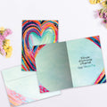 Load image into Gallery viewer, The inside of Tree-Free’s Artful Heart card, with the cover and envelope in the background.