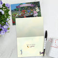 Load image into Gallery viewer, The inside of Tree-Free’s Family Blessings card, with the cover and envelope in the background.