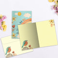 Load image into Gallery viewer, The inside of Tree-Free’s Sky Limit card, with the cover and envelope in the background.