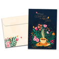 Load image into Gallery viewer, Cover of Comfort Wish Support & Encouragement card (featuring script and serif text above artwork of a teacup sitting on top of a book surrounded by butterflies and flowers) and its matching envelope