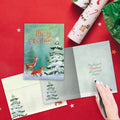 Load image into Gallery viewer, The inside of Tree-Free’s Winter Joy card, with the cover and envelope in the background.