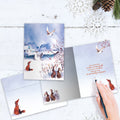 Load image into Gallery viewer, The inside of Tree-Free’s Winter Serenity card, with the cover and envelope in the background.
