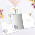 Load image into Gallery viewer, The inside of Tree-Free’s Hello Little One card, with the cover and envelope in the background.