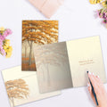 Load image into Gallery viewer, The inside of Tree-Free’s Autumn Memories card, with the cover and envelope in the background.