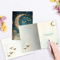 Load image into Gallery viewer, The inside of Tree-Free’s Starlight Moonbeams card, with the cover and envelope in the background.
