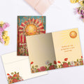 Load image into Gallery viewer, The inside of Tree-Free’s Happy Sunshine card, with the cover and envelope in the background.