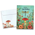 Load image into Gallery viewer, Cover of Dragonfly Toadstool Birthday card (featuring serif text above artwork of a dragonfly flying above a field of flowers and mushrooms) and its matching envelope