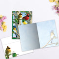 Load image into Gallery viewer, The inside of Tree-Free’s Favorite Songbirds card, with the cover and envelope in the background.