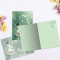 Load image into Gallery viewer, The inside of Tree-Free’s Lily Of The Valley All Occasion Card card, with the cover and envelope in the background.