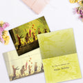 Load image into Gallery viewer, The inside of Tree-Free’s Secret Parade card, with the cover and envelope in the background.