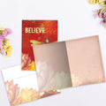 Load image into Gallery viewer, The inside of Tree-Free’s Believe card, with the cover and envelope in the background.