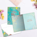 Load image into Gallery viewer, The inside of Tree-Free’s Remember Your Life card, with the cover and envelope in the background.
