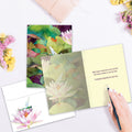 Load image into Gallery viewer, The inside of Tree-Free’s Waterlilies And Dragonfly card, with the cover and envelope in the background.