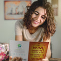 Load image into Gallery viewer, Lifestyle image(s) featuring Tree-Free’s Improved With Wine card
