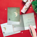 Load image into Gallery viewer, The inside of Tree-Free’s Holy Night card, with the cover and envelope in the background.