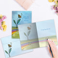 Load image into Gallery viewer, The inside of Tree-Free’s Faith Friends Family Support Card card, with the cover and envelope in the background.