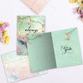 Load image into Gallery viewer, The inside of Tree-Free’s Choose You Again card, with the cover and envelope in the background.