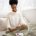 Load image into Gallery viewer, Lifestyle image(s) featuring Tree-Free’s Loved Well Pawprints card