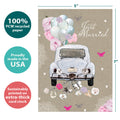 Load image into Gallery viewer, The cover of Tree-Free’s Just Married Wedding Card card with lines demonstrating its 5x7 dimensions, along with the following text: “100% PCW recycled paper, proudly made in the USA, sustainably printed on extra-thick card stock”