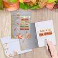 Load image into Gallery viewer, The inside of Tree-Free’s Cozy Fall card, with the cover and envelope in the background.