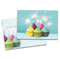 Load image into Gallery viewer, Cover of Extra Sparkly Birthday card (featuring artwork of cupcakes with lit sparklers sticking out of them) and its matching envelope