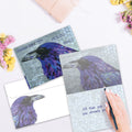 Load image into Gallery viewer, The inside of Tree-Free’s Healing Raven Support Card card, with the cover and envelope in the background.