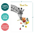 Load image into Gallery viewer, The cover of Tree-Free’s Floral Giraffe Thanks card with lines demonstrating its 5x7 dimensions, along with the following text: “100% PCW recycled paper, proudly made in the USA, sustainably printed on extra-thick card stock”