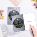 Load image into Gallery viewer, The inside of Tree-Free’s Tree Of Life And Light Support Card card, with the cover and envelope in the background.