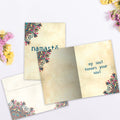 Load image into Gallery viewer, The inside of Tree-Free’s Namaste card, with the cover and envelope in the background.