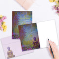 Load image into Gallery viewer, The inside of Tree-Free’s Gratitude Buddha card, with the cover and envelope in the background.
