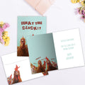 Load image into Gallery viewer, The inside of Tree-Free’s What The Cluck card, with the cover and envelope in the background.