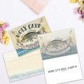 Load image into Gallery viewer, The inside of Tree-Free’s Holy Carp card, with the cover and envelope in the background.
