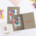 Load image into Gallery viewer, The inside of Tree-Free’s Shama Llama card, with the cover and envelope in the background.