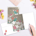 Load image into Gallery viewer, The inside of Tree-Free’s Floral Bird Thanks card, with the cover and envelope in the background.