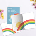 Load image into Gallery viewer, The inside of Tree-Free’s Sunshine And Rainbows card, with the cover and envelope in the background.