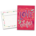 Load image into Gallery viewer, The cover of Tree-Free's Love Is Life card, along with its matching envelope.