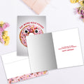 Load image into Gallery viewer, The inside of Tree-Free’s Hole Foods card, with the cover and envelope in the background.