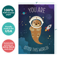 Load image into Gallery viewer, The cover of Tree-Free’s Otter This World Birthday card with lines demonstrating its 5x7 dimensions, along with the following text: “100% PCW recycled paper, proudly made in the USA, sustainably printed on extra-thick card stock”