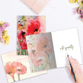 Load image into Gallery viewer, The inside of Tree-Free’s Floral Watercolor Sympathy Card card, with the cover and envelope in the background.