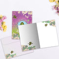 Load image into Gallery viewer, The inside of Tree-Free’s Sparkle Bird card, with the cover and envelope in the background.