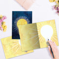 Load image into Gallery viewer, The inside of Tree-Free’s Brighten My World card, with the cover and envelope in the background.