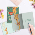Load image into Gallery viewer, The inside of Tree-Free’s Giraffe Mom card, with the cover and envelope in the background.