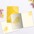 Load image into Gallery viewer, The inside of Tree-Free’s Sunshine Season card, with the cover and envelope in the background.