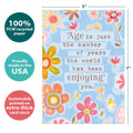 Load image into Gallery viewer, The cover of Tree-Free’s The World Enjoys You card with lines demonstrating its 5x7 dimensions, along with the following text: “100% PCW recycled paper, proudly made in the USA, sustainably printed on extra-thick card stock”