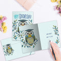 Load image into Gallery viewer, The inside of Tree-Free’s Graduation Owl card, with the cover and envelope in the background.