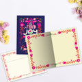 Load image into Gallery viewer, The inside of Tree-Free’s Find Joy Flowers card, with the cover and envelope in the background.