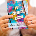 Load image into Gallery viewer, Lifestyle image(s) featuring Tree-Free’s Vibrant Love You card